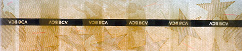 Piece bbcv1000000bss-aa01-h8 (Obverse, partial, in front of light)