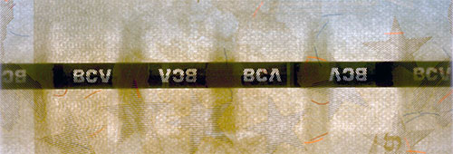 Piece bbcv1000000bss-ab01-a8 (Obverse, partial, in front of light)