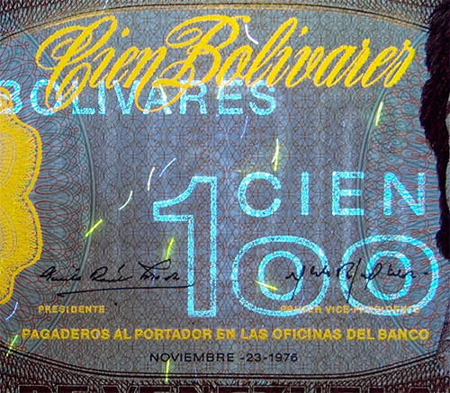 Piece bbcv100bs-db02-z7 (Obverse, partial, under ultraviolet light)