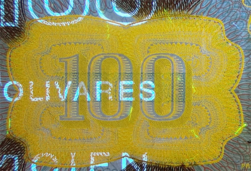 Piece bbcv100bs-db04-f8 (Obverse, partial, under ultraviolet light)