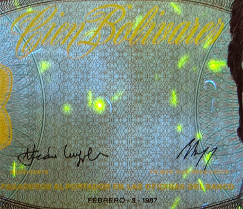 Piece bbcv100bs-dc01-h8 (Obverse, partial, under ultraviolet light)