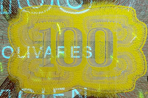 Piece bbcv100bs-dd03-y8 (Obverse, partial, under ultraviolet light)