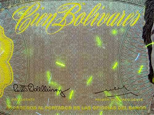 Piece bbcv100bs-dd03-y8 (Obverse, partial, under ultraviolet light)