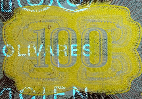 Piece bbcv100bs-dd04-k8 (Obverse, partial, under ultraviolet light)