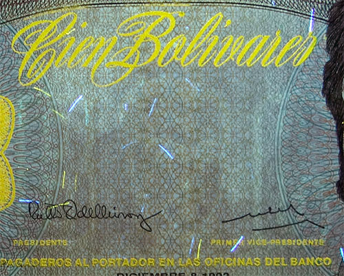 Piece bbcv100bs-dd04-k8 (Obverse, partial, under ultraviolet light)