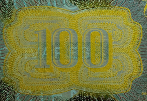 Piece bbcv100bs-dd05-g8 (Obverse, partial, under ultraviolet light)