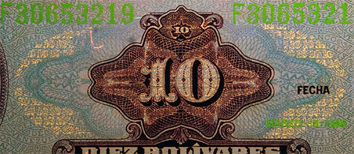 Piece bbcv10bs-eb01-f8 (Obverse, partial, under ultraviolet light)