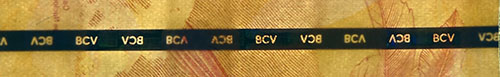 Piece bbcv20000bsf-ac01-c8 (Obverse, partial, in front of light)