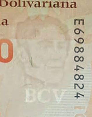 Piece bbcv50000bss-ab01-e8 (Obverse, partial, in front of light)