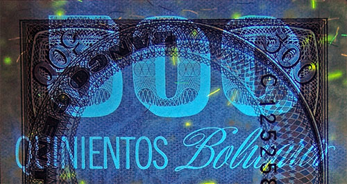 Piece bbcv500bs-ea02-c8 (Obverse, partial, under ultraviolet light)