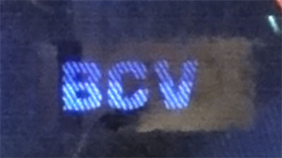 Piece bbcv500bss-aa02-e8 (Obverse, partial, under ultraviolet light)