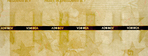 Piece bbcv5bsd-aa01-a8 (Obverse, partial, in front of light)
